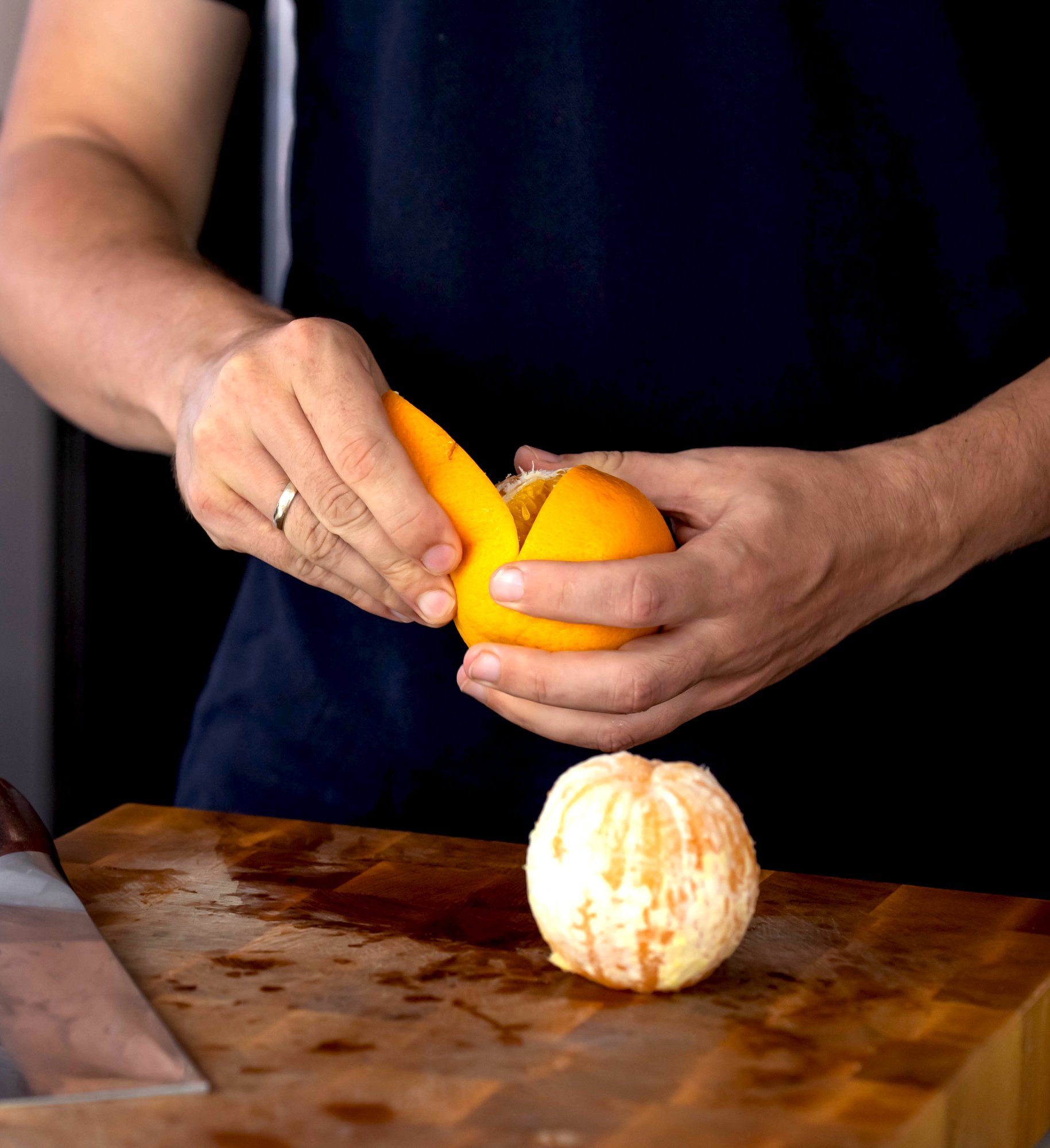 chef peeling and orange chef peeling and orange
